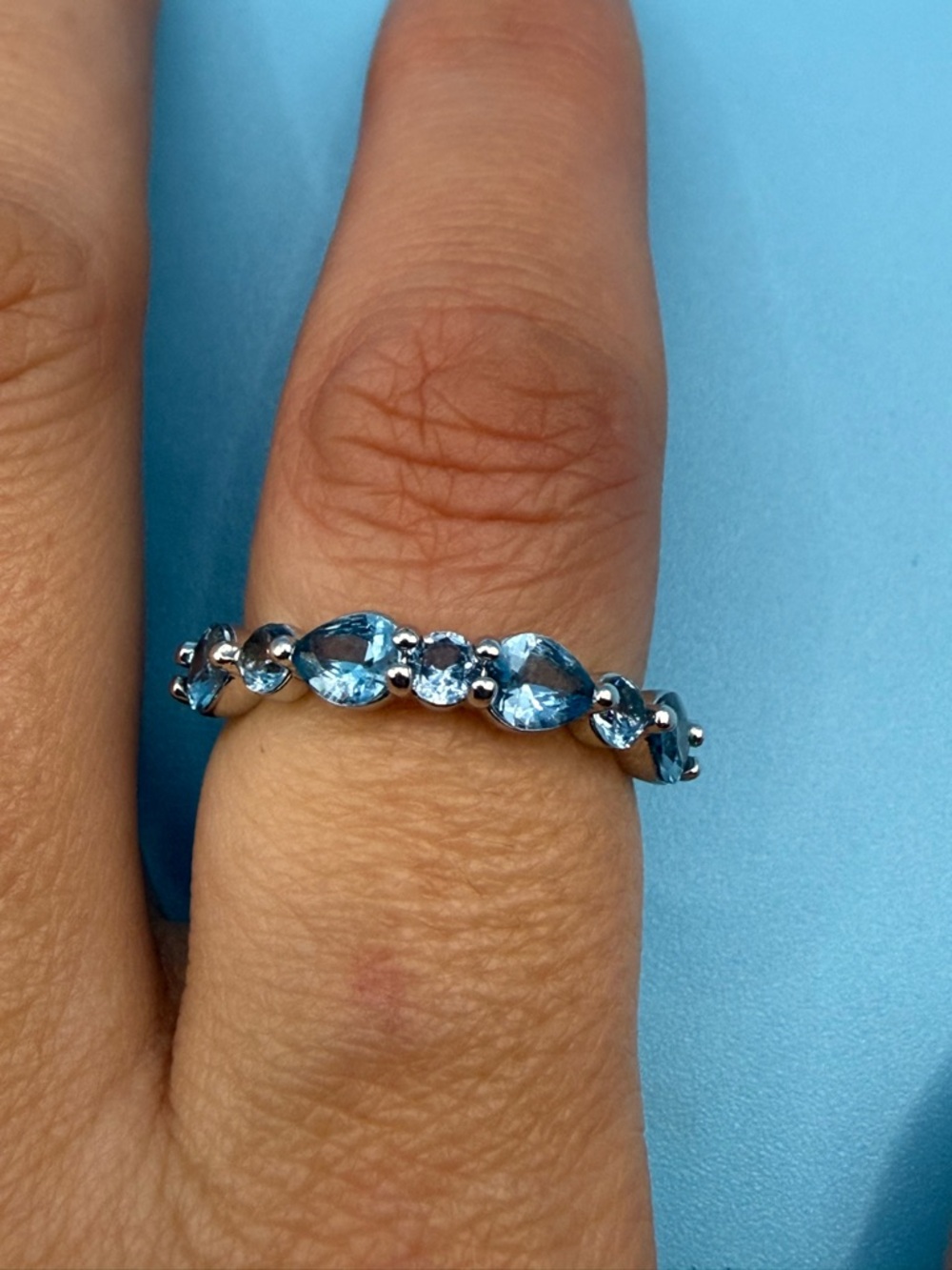 Silver Ring with Blue Pear & Round Gemstones - Sparkling Blue Band